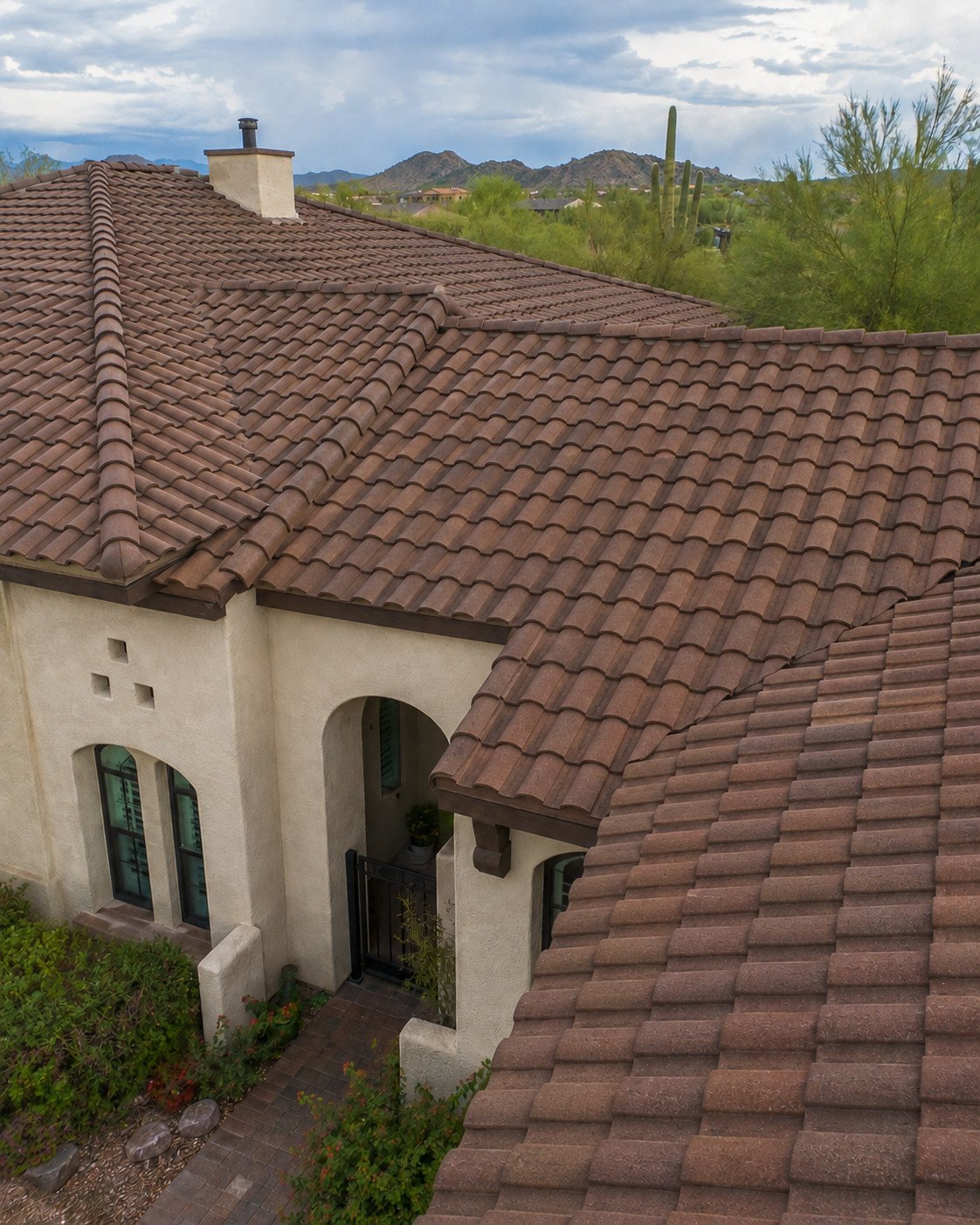 The same tile roof restored, with the field relaid straight and complete